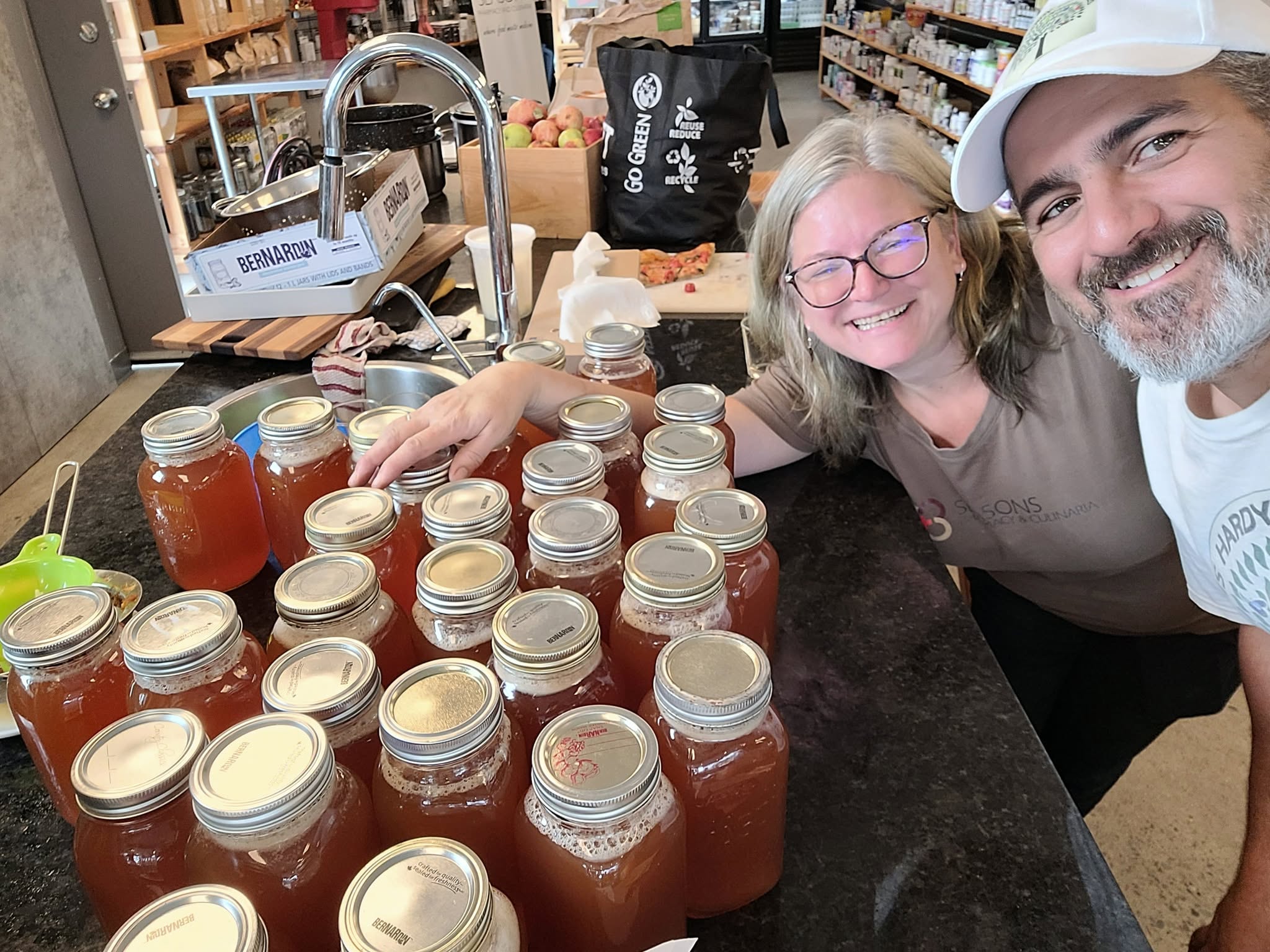 Apple Fest organizers with jars of fresh cider